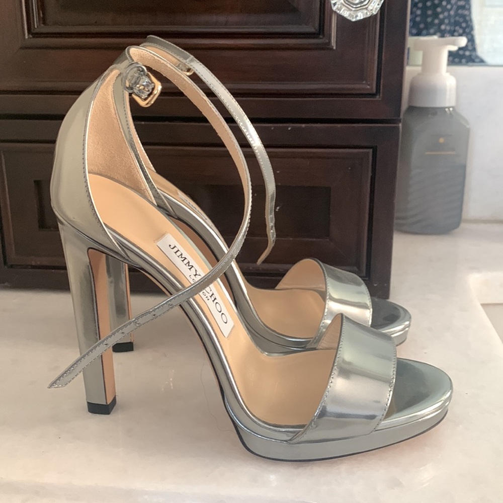 Jimmy choo never worn shoes! Silver, strappy, sexy high heel.